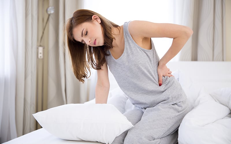 Woman clutching back in pain